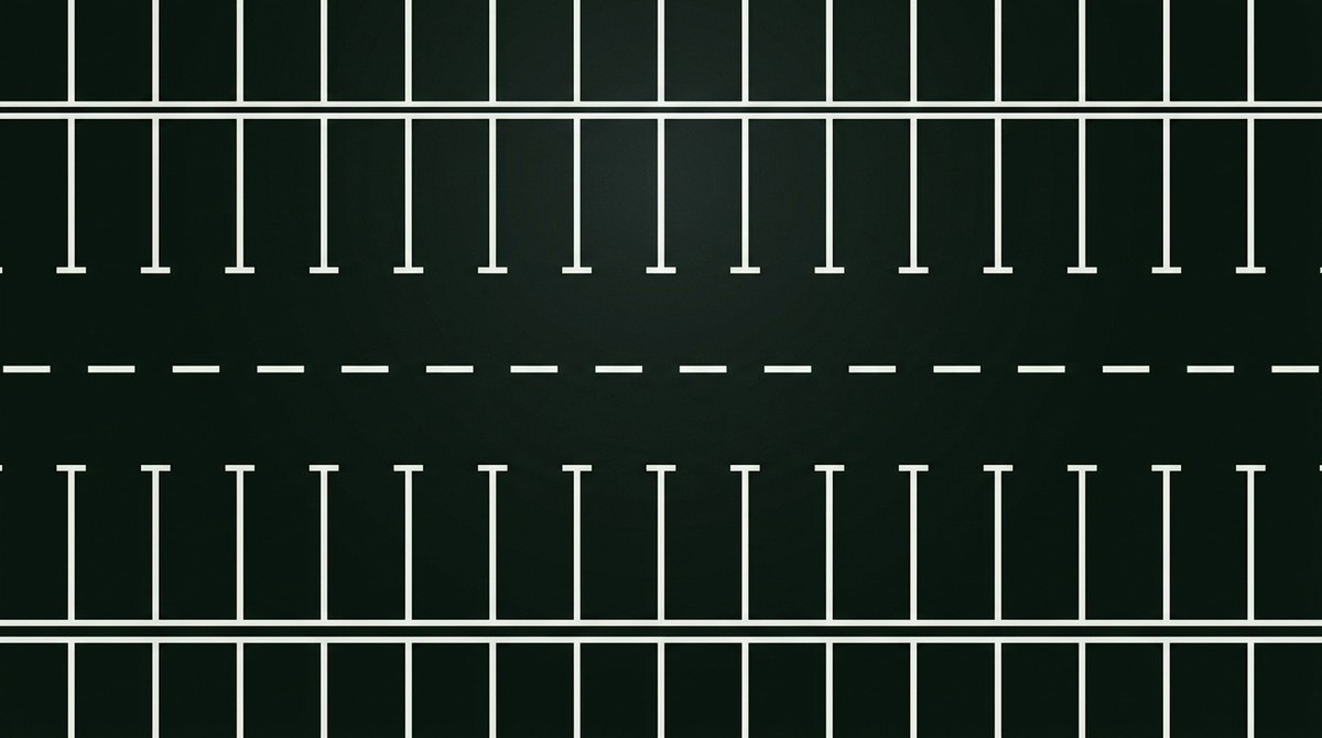 Plan view of freshly painted white parking bays either side of a dashed aisle line