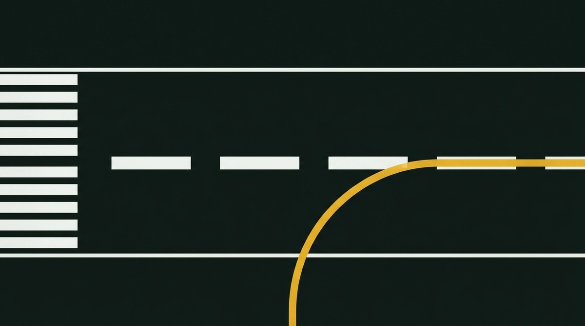 Runway centreline of broad white dashes with white threshold stripes and a yellow taxiway centreline curving in to join it