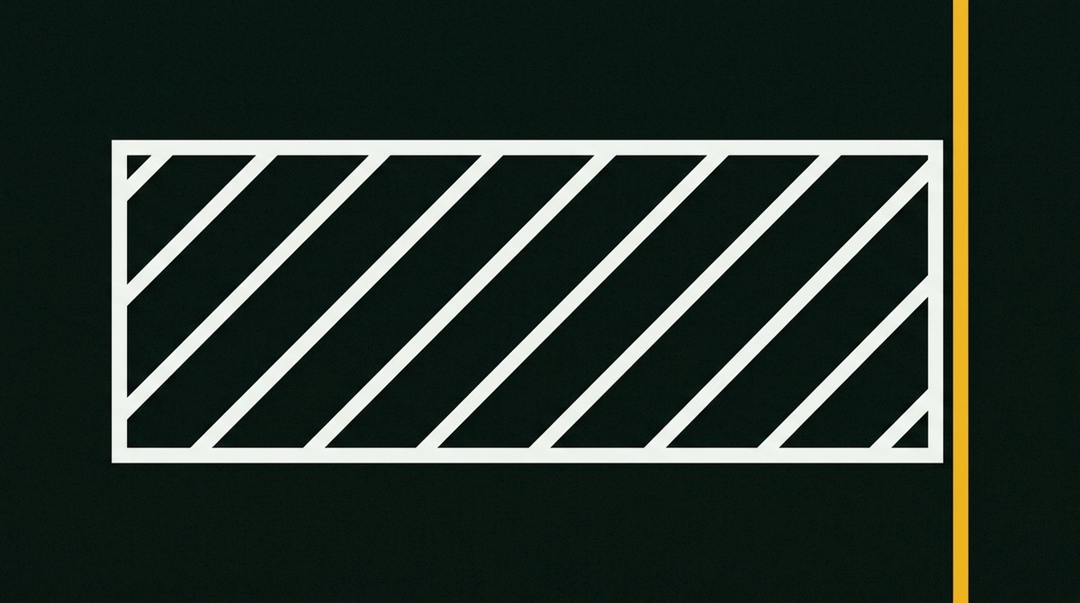 White hatched keep-clear safety zone box beside a solid yellow edge line
