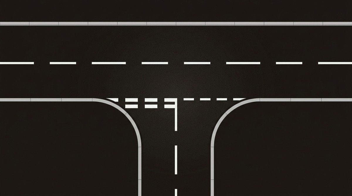 T-intersection of new estate roads with an uninterrupted centre line, a give-way holding line and kerbed corner radii